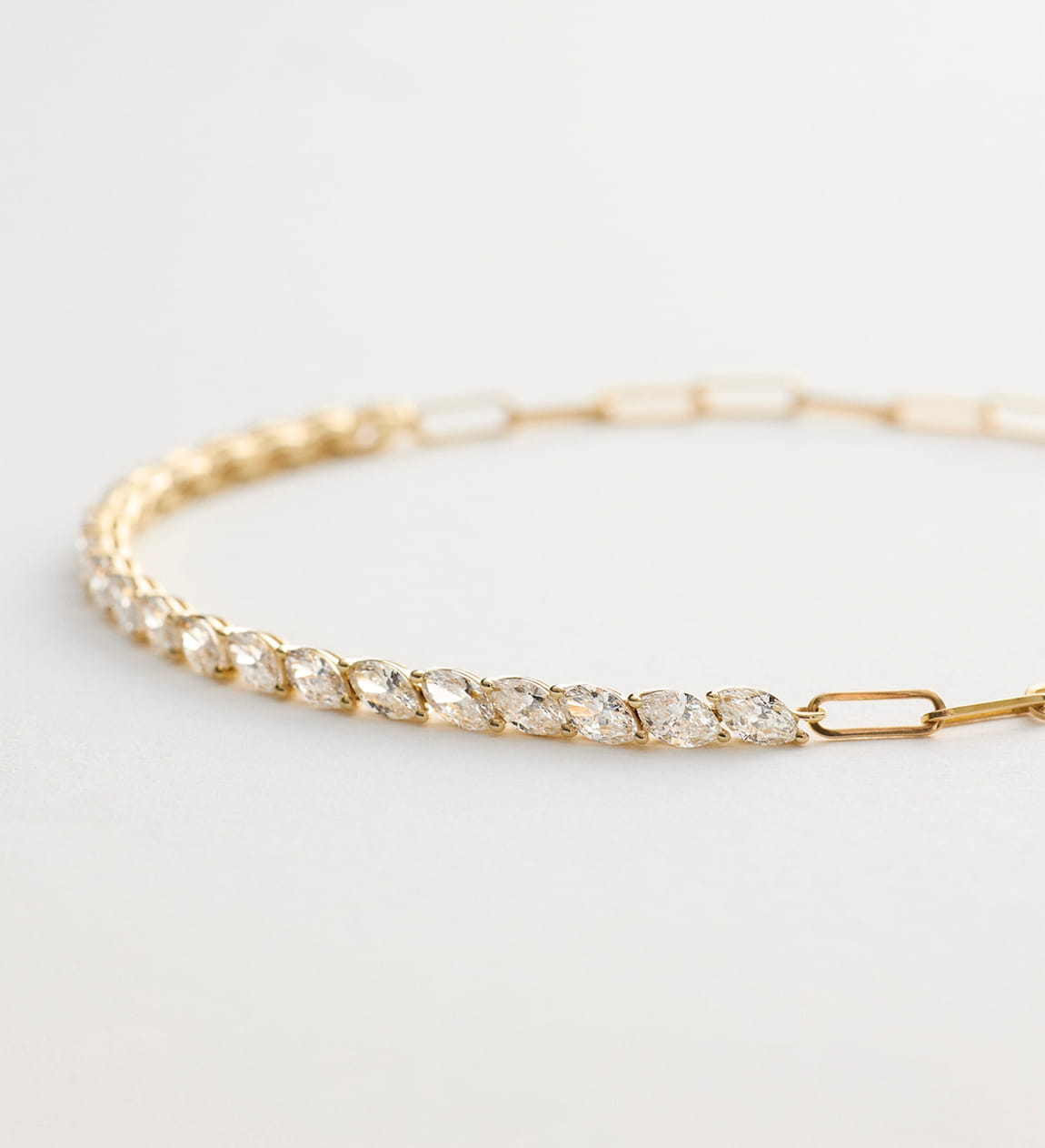 gold mini tennis bracelet with pear-cut diamonds